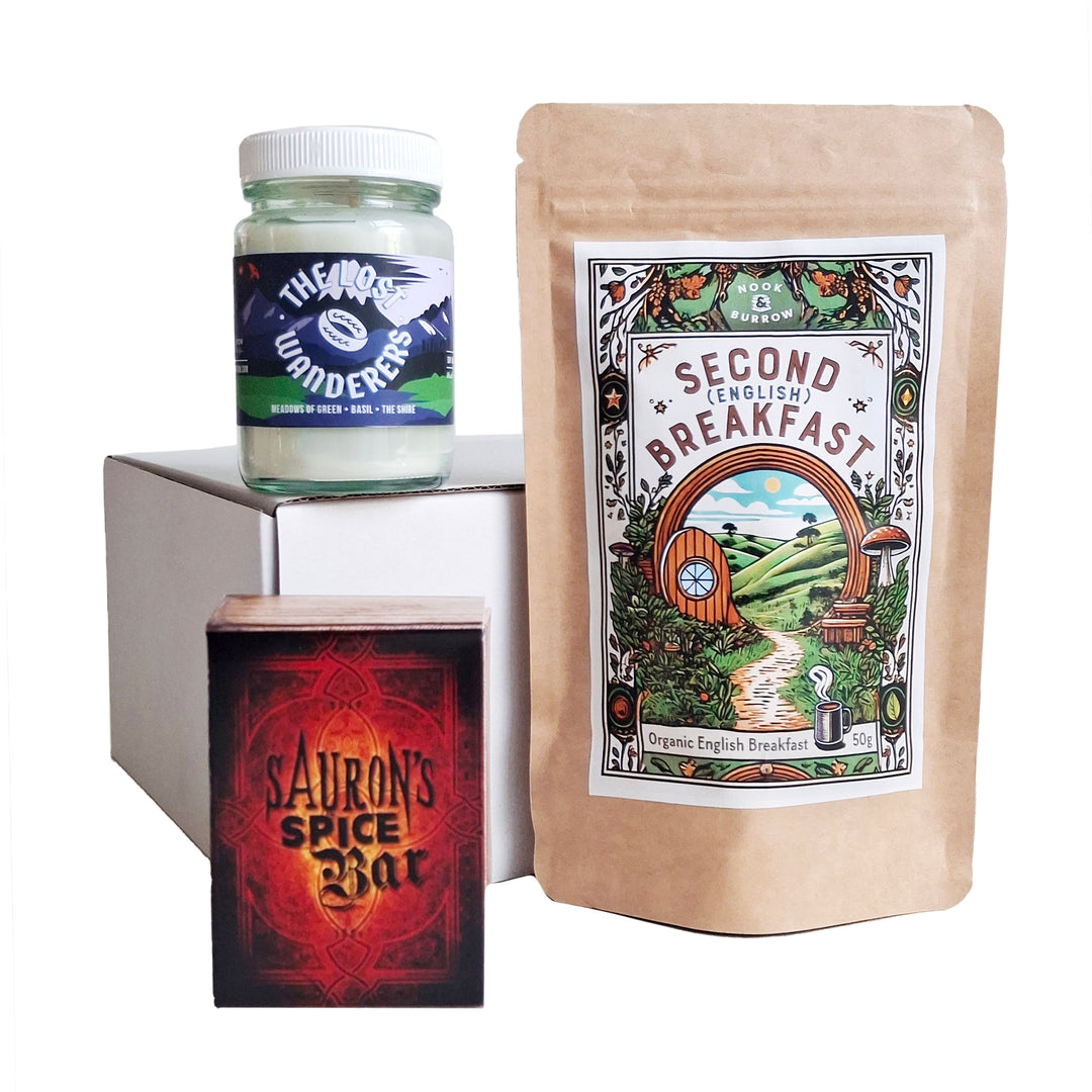 Hobbit-inspired trio featuring “Second Breakfast” English Breakfast tea, “The Lost Wanderers” candle, and “Sauron’s Spice Bar” soap.